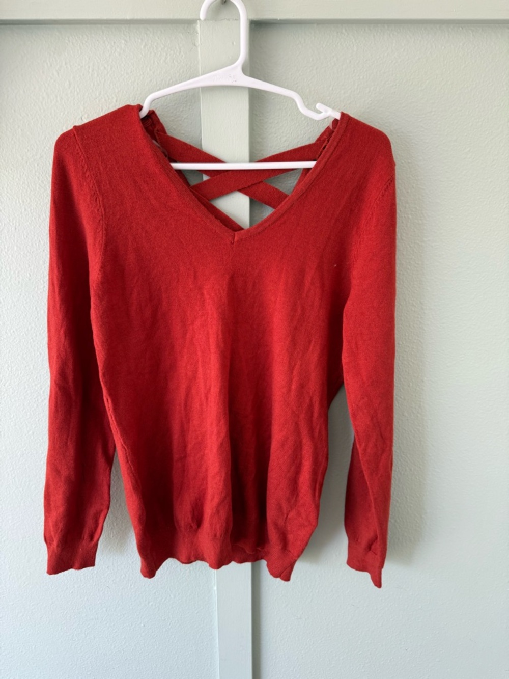 Women’s Crisscross V-Neck Sweater in Red
